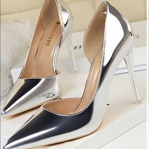 Shiny silver BigTree Shoes size 10 (42) never worn. Did not come in box.4” heel